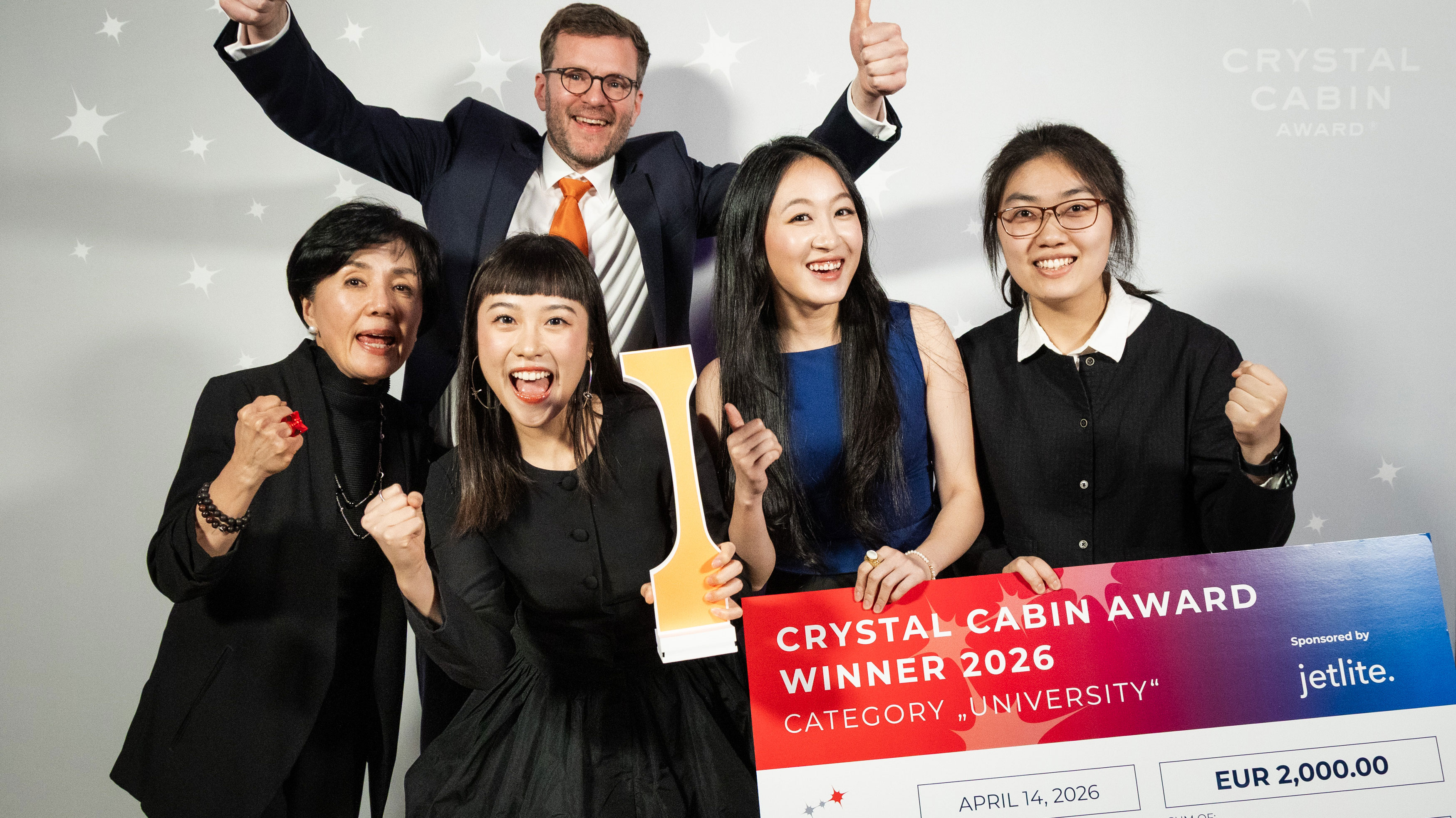 Georgia Tech representatives pose with a Crystal Cabin Award trophy and winner's check after receiving the 2026 Crystal Cabin Award in the University category.