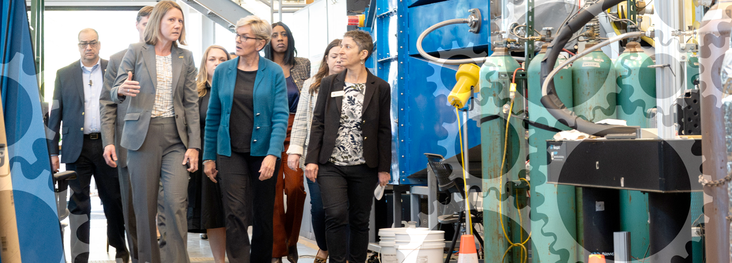 Krista Walton leads a group of U.S. Secretary of Energy representatives on a tour through a Georgia Tech lab.