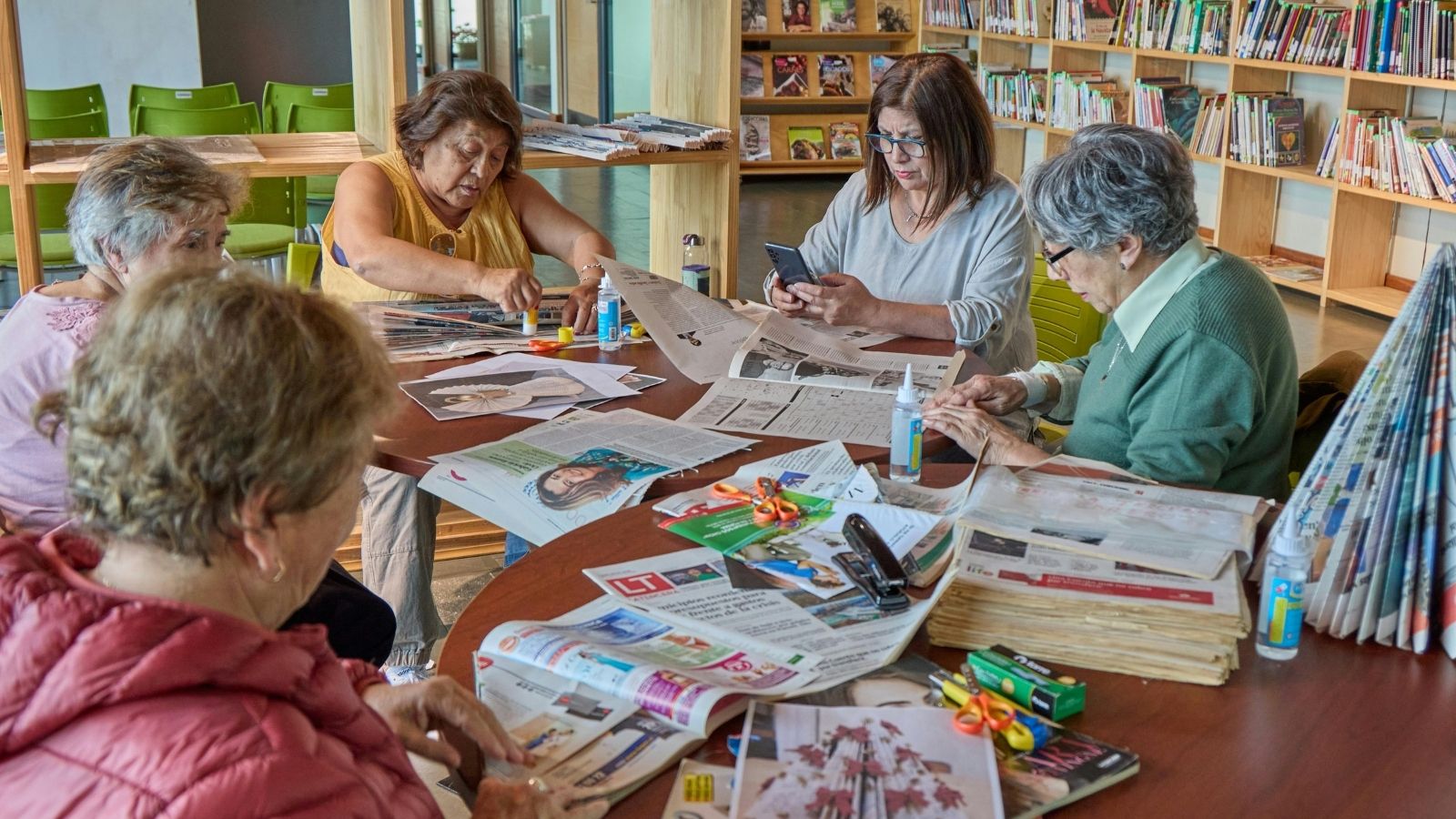 Stock photo of older women crafting together around a table
