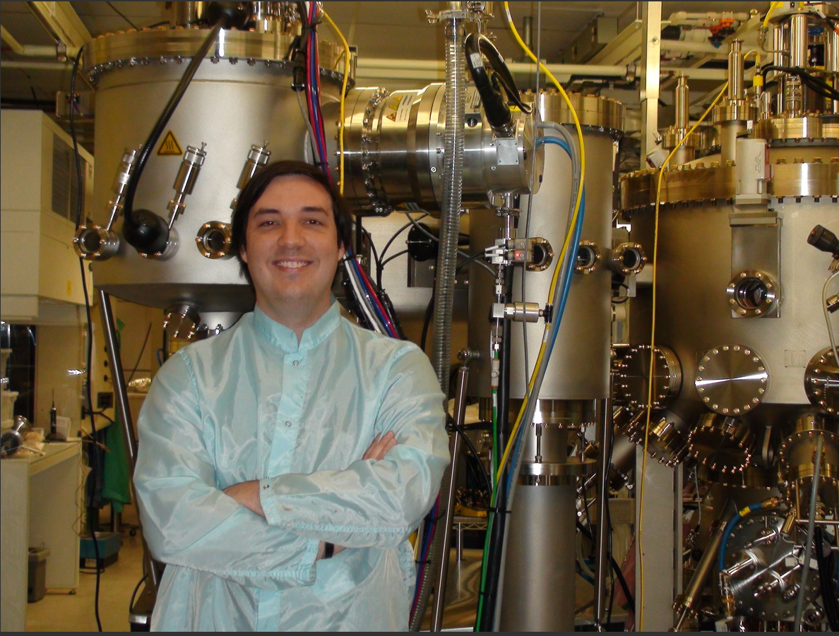 Carver stands in front of JPL’s brand new MBE device, 2009.