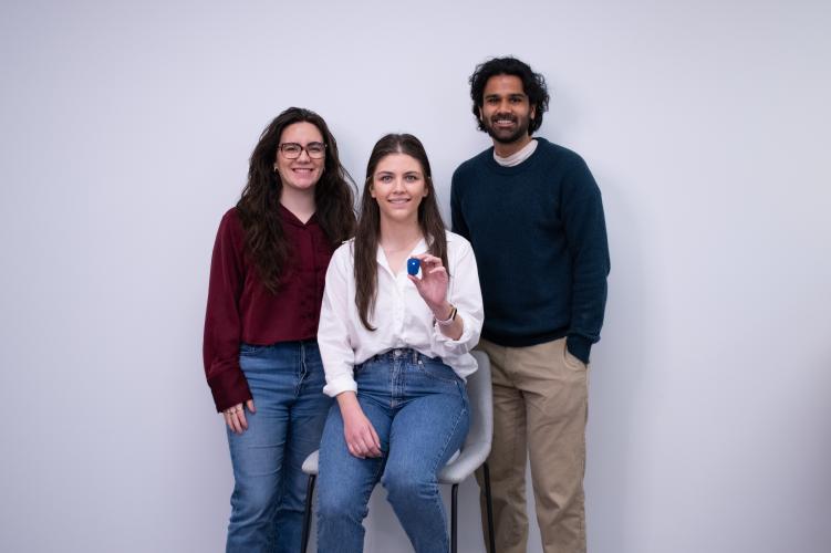 From left to right, Stridelink Founders Cassandra McIltrot , Marzeah “Zea” Khorramabadi, and Neel Narvekar. Khorramabadi is holding one of their sensors, a device like a watch.