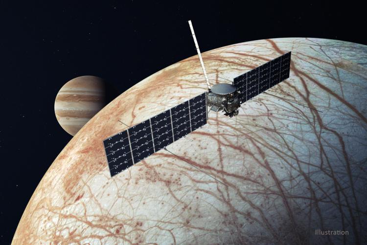 Illustration of NASA's Europa Clipper spacecraft with Jupiter and its icy moon Europa in the background (Credit: NASA/JPL-Caltech)