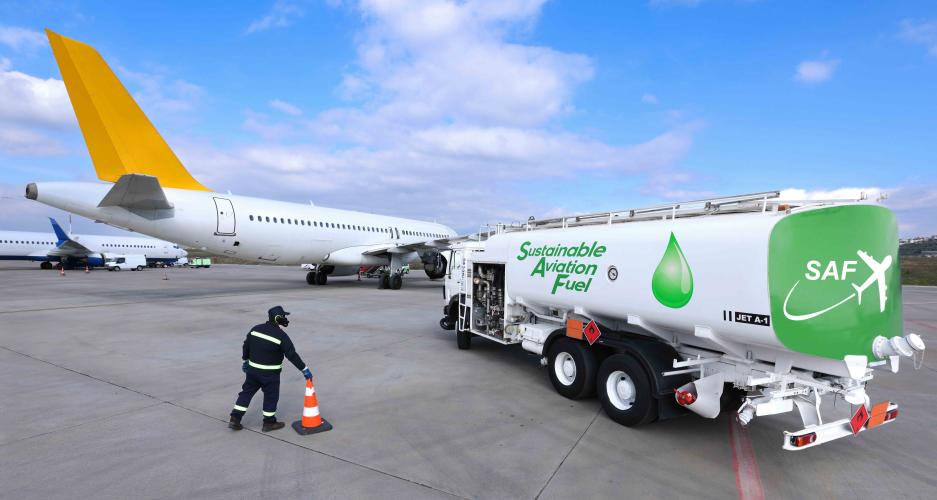 Fuel Truck carrying Sustainable Aviation Fuel near an airplane
