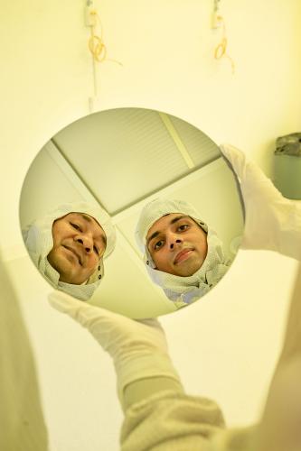 Researchers holding chip