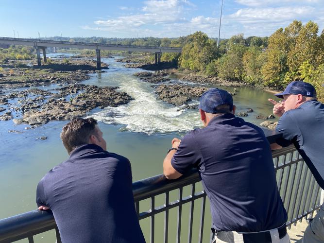 This image shows Columbus firefighters overlooking the Chattahoochee River