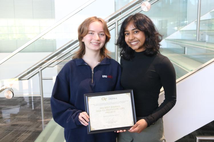 Electrosuit Founders Aubrey Hall and Sherya Chakraborty pose for their third place win in the Spring 2024 I2P Showcase