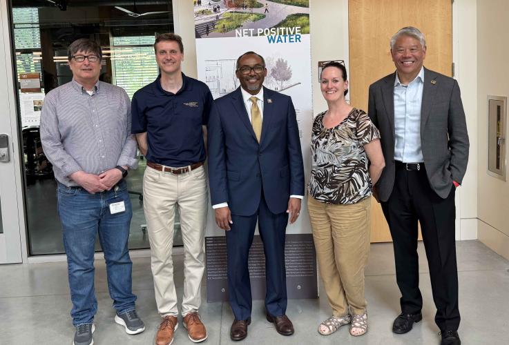 Picture of Gary McMurray (GTRI), Rich Simmons (SEI), Christine Conwell (SEI) and John Tien (SEI)