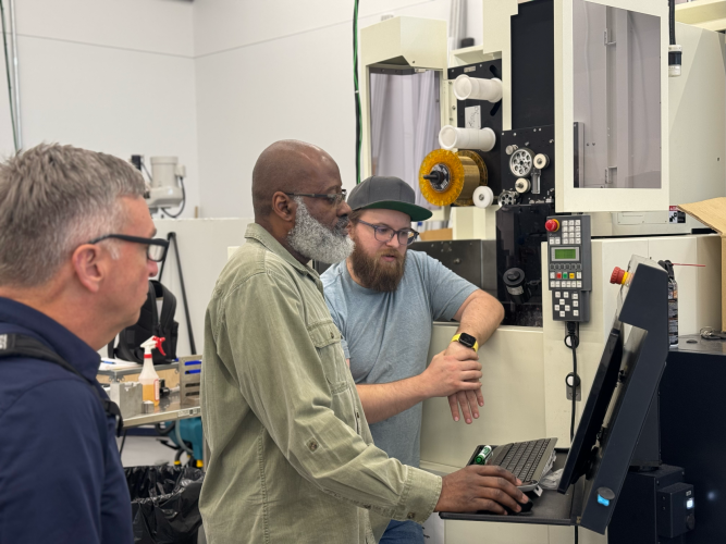 As part of the partnership, Southern Regional Technical College Instructor Marvin Bannister (center) received hands-on training on advanced machining equipment to prepare for teaching Georgia’s next generation of manufacturers.