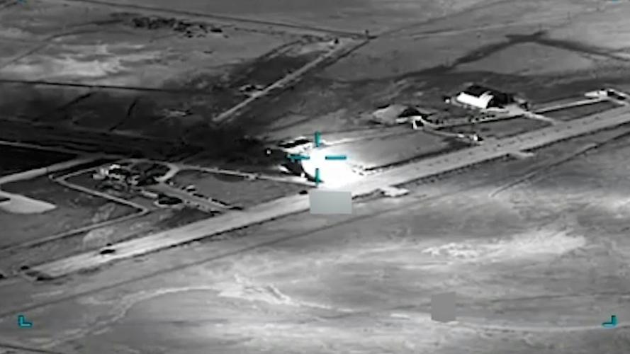  black and white aerial view of an airfield AI is helping U.S. forces find and choose targets in Iran, like this airfield. U.S. Central Command via AP