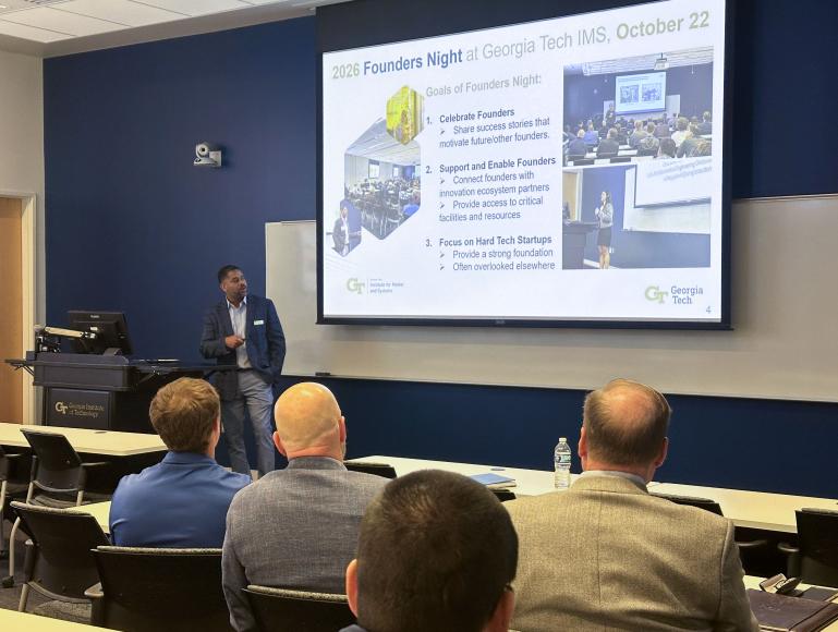 Billyde Brown addresses attendees beneath a slide outlining goals for 2026 Founders Night at Georgia Tech IMS, including celebrating, supporting, and enabling founders.