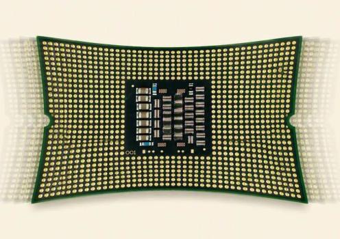 Flexible electronic device with a dense array of interconnects bends under mechanical strain, demonstrating stretchable semiconductor packaging and advanced flexible electronics technology.