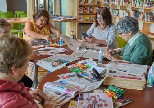 Stock photo of older women crafting together around a table