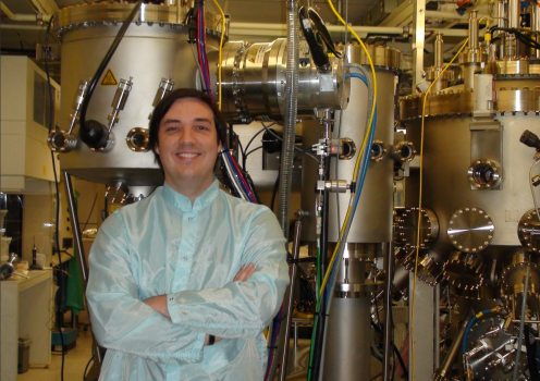 Carver stands in front of JPL’s brand new MBE device, 2009.