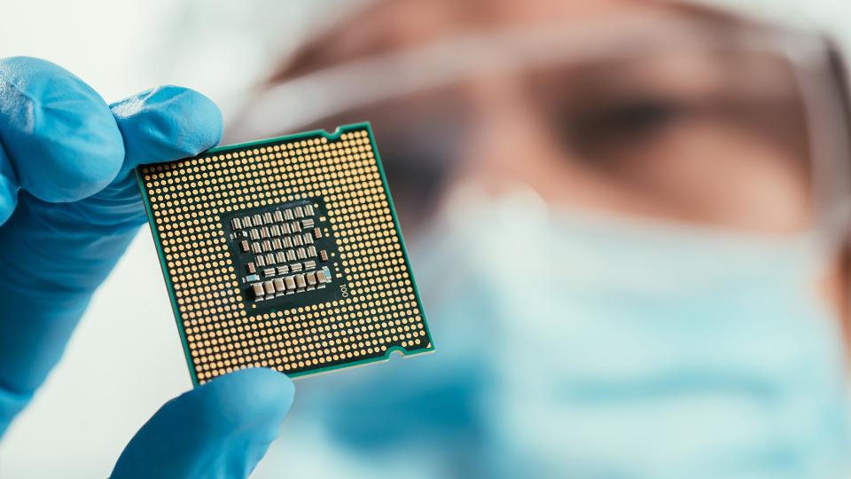 Man holding computer chip