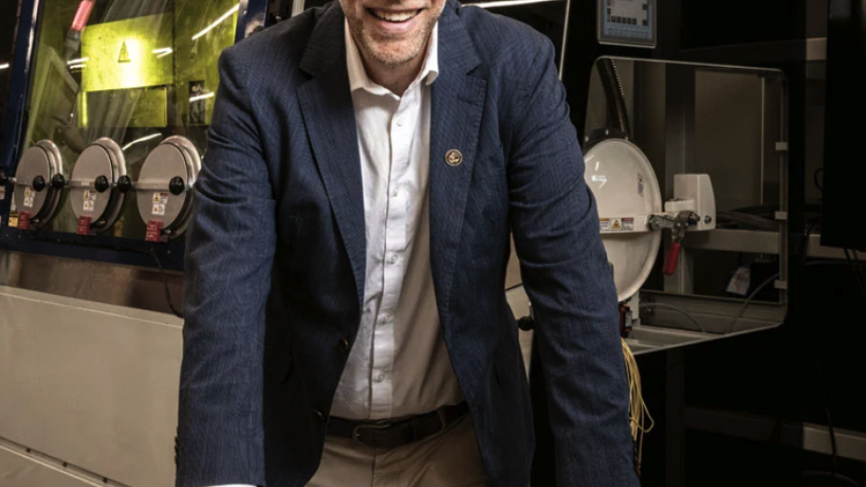 Harnessing Automation: John Morehouse, director of the Georgia Center of Innovation for Manufacturing at the Georgia Department of Economic Development, with a laser cutter at Georgia Tech that produced a variety of parts Photo: Kevin Garrett