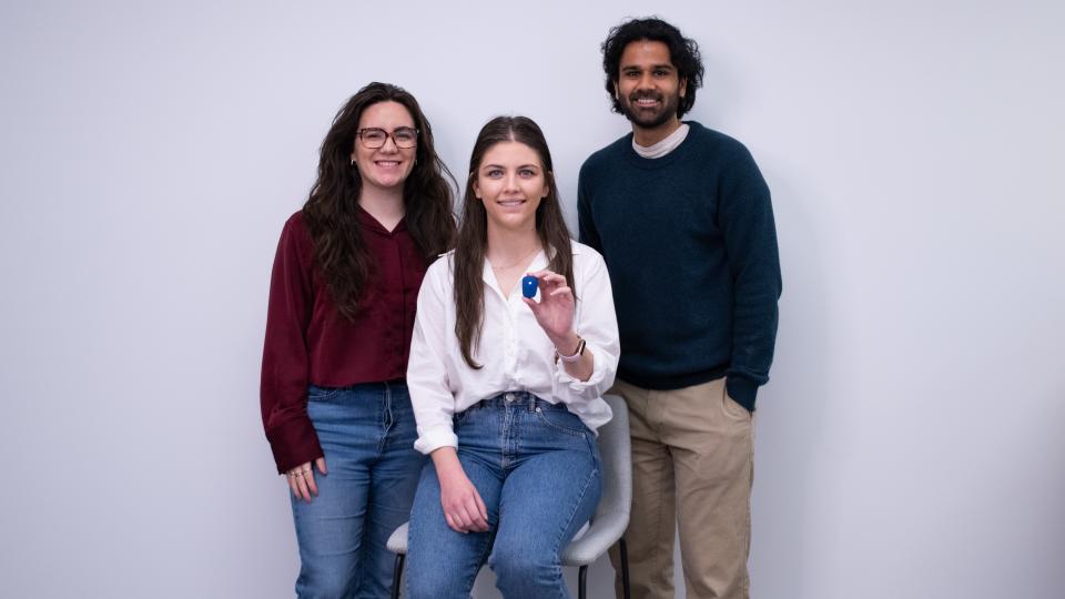 From left to right, Stridelink Founders Cassandra McIltrot , Marzeah “Zea” Khorramabadi, and Neel Narvekar. Khorramabadi is holding one of their sensors, a device like a watch.