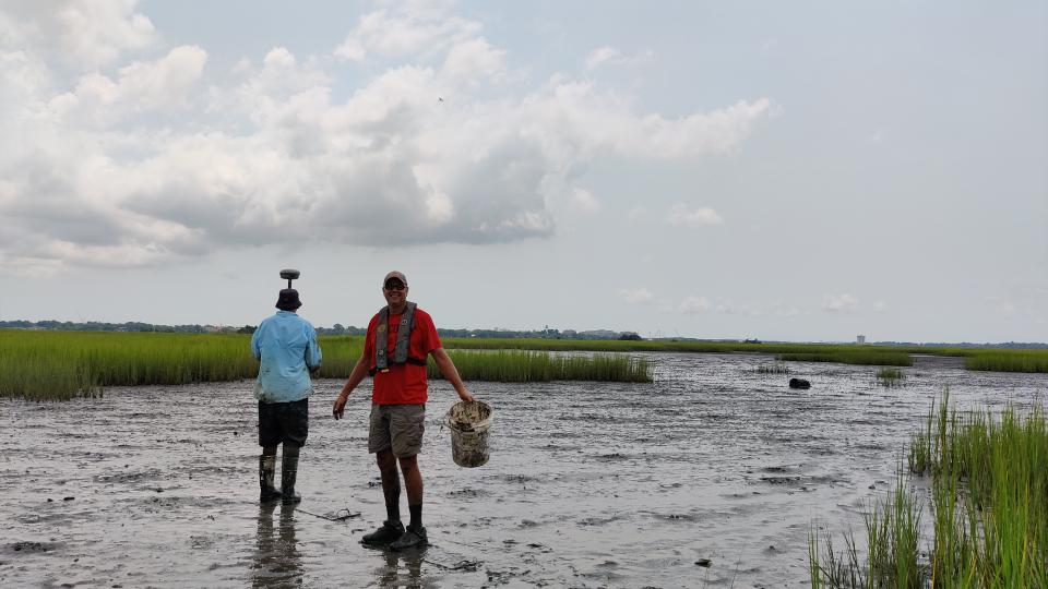 two people walking in flood water