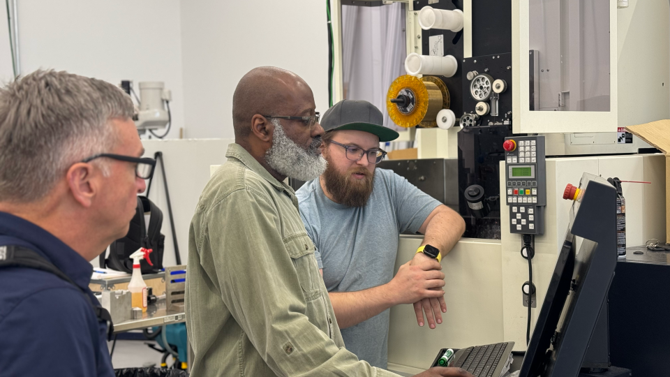 As part of the partnership, Southern Regional Technical College Instructor Marvin Bannister (center) received hands-on training on advanced machining equipment to prepare for teaching Georgia’s next generation of manufacturers.