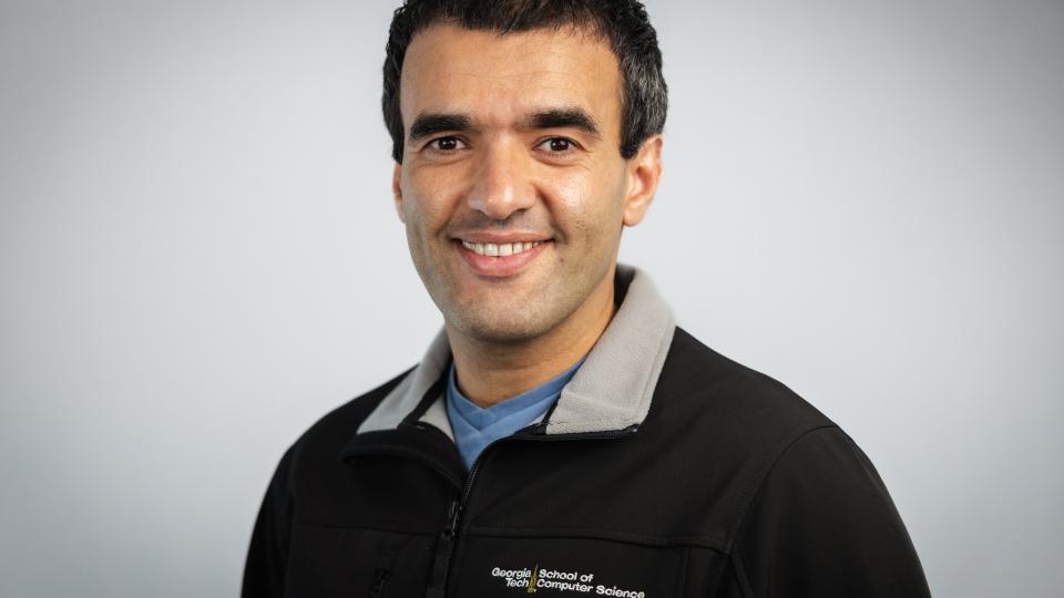 man in a pullover smiling