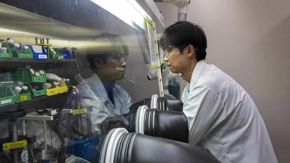 Sun Geun Yoon works in a glove box in McDowell’s laboratory at Georgia Tech.