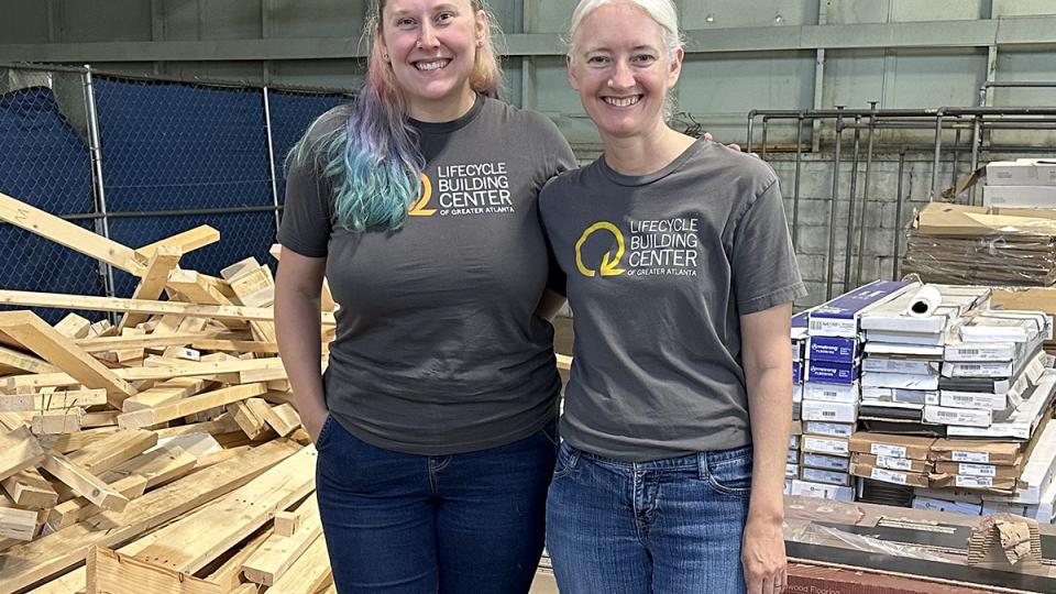 Georgia Tech intern Morgan Hale and Lifecyle Building Center Executive Director Shannon Goodman stand in a warehouse.
