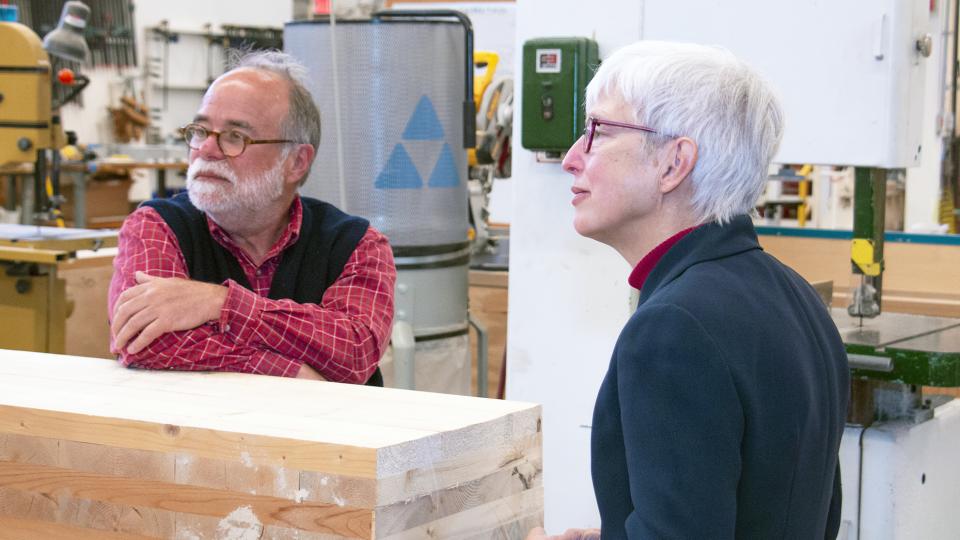 Two faculty who hold joint appointments working in a lab.