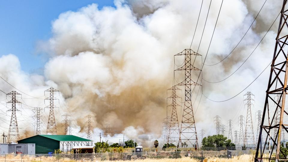 Smoke cloud rising from a brush wildfire burning in San Francisco, California