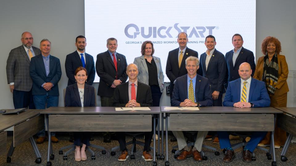 Georgia Quick Start Deputy Commissioner Scott McMurray (center left) and Georgia Tech Executive Vice President for Research Tim Lieuwen (center right) gathered with members of the Georgia Tech Manufacturing Institute, Georgia AIM, and more to officially commemorate the partnership on April 8.