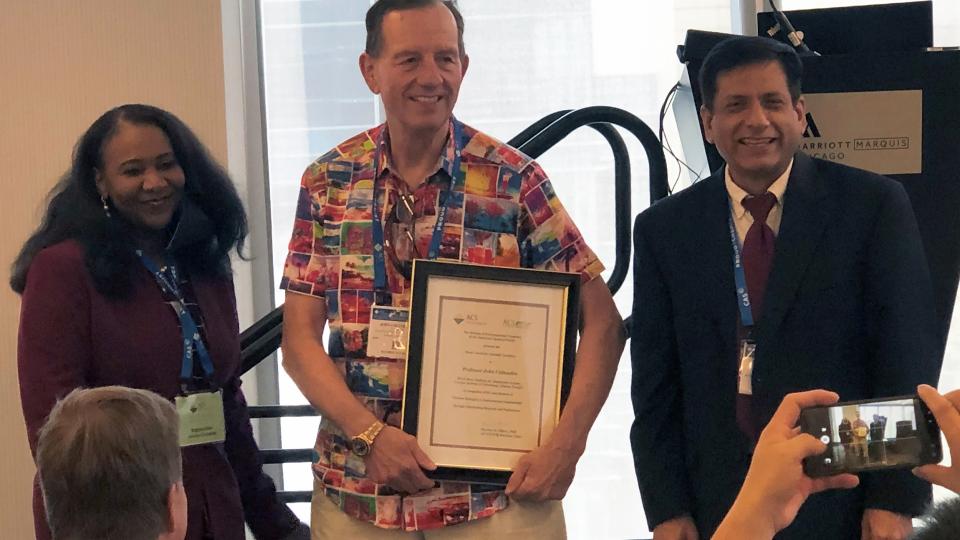 John Crittenden receiving an ACS Honor Award. L to R: Sherine Obare, John Crittenden, Sharma Virender