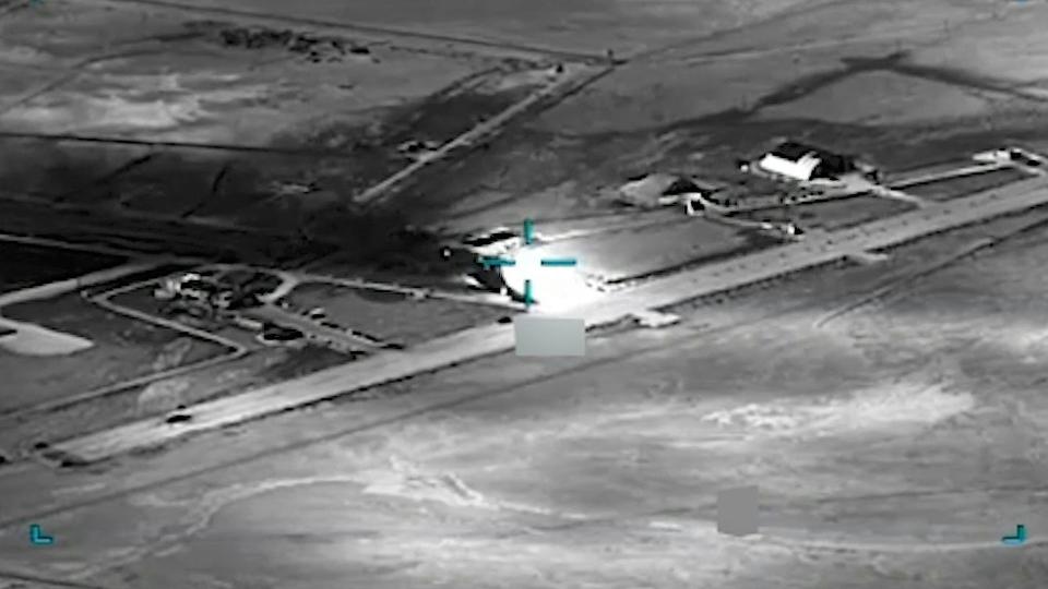  black and white aerial view of an airfield AI is helping U.S. forces find and choose targets in Iran, like this airfield. U.S. Central Command via AP