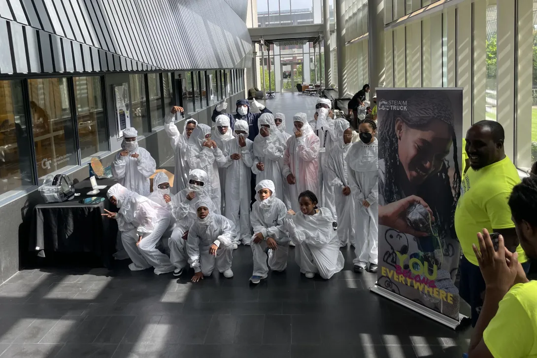 Students pose in bunny suits during Chips Camp.