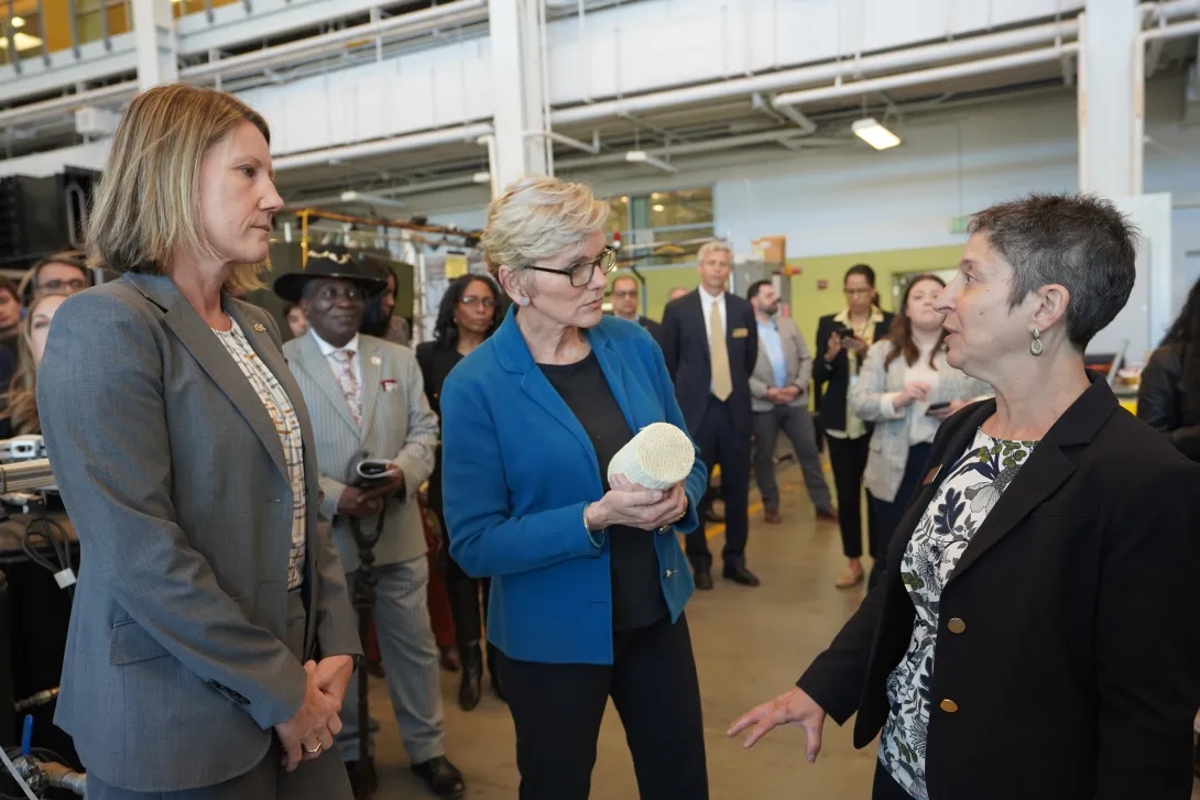 U.S. Secretary of Energy Jennifer Granholm (center) is brought up to date by Georgia Tech's Krista Walton (left) and Jennifer Hirsch (right) during a 2024 visit to campus.