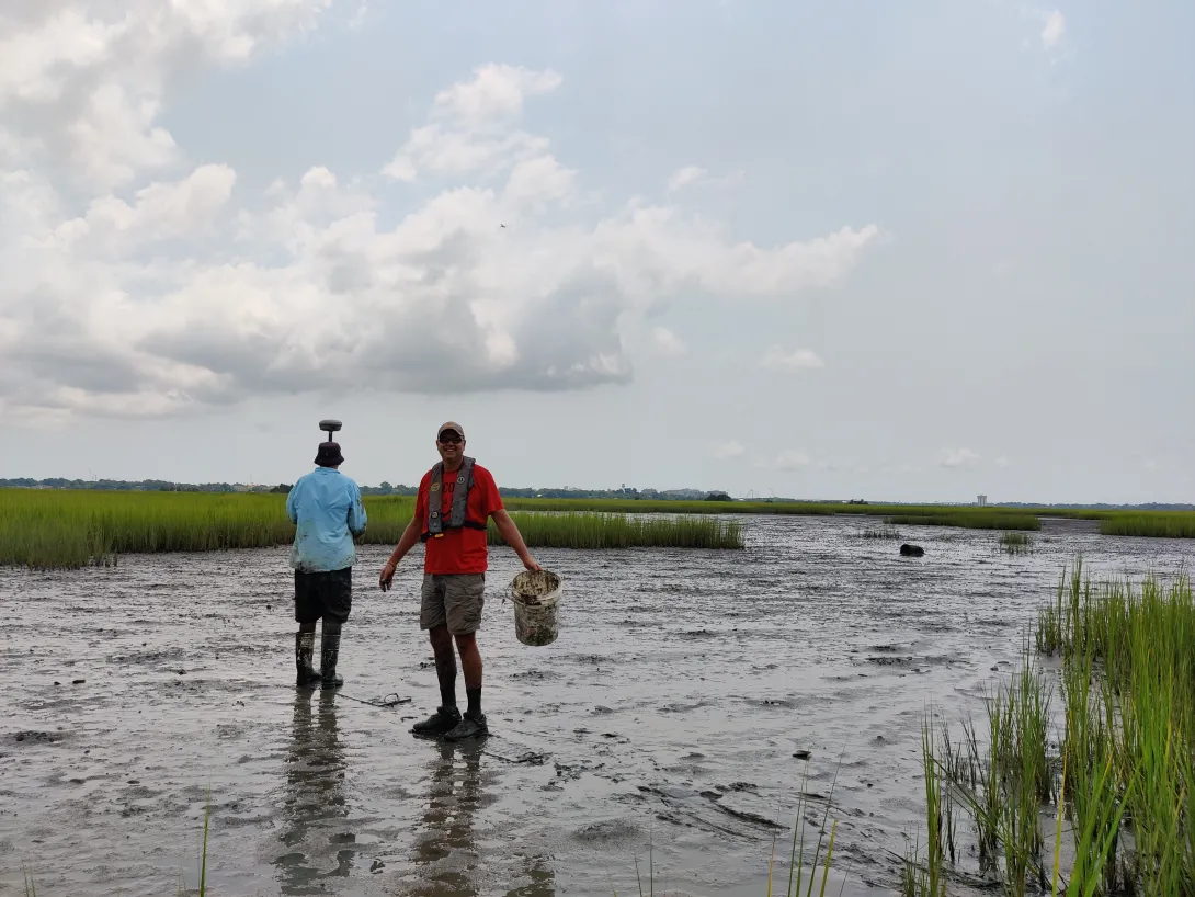 two people walking in flood water