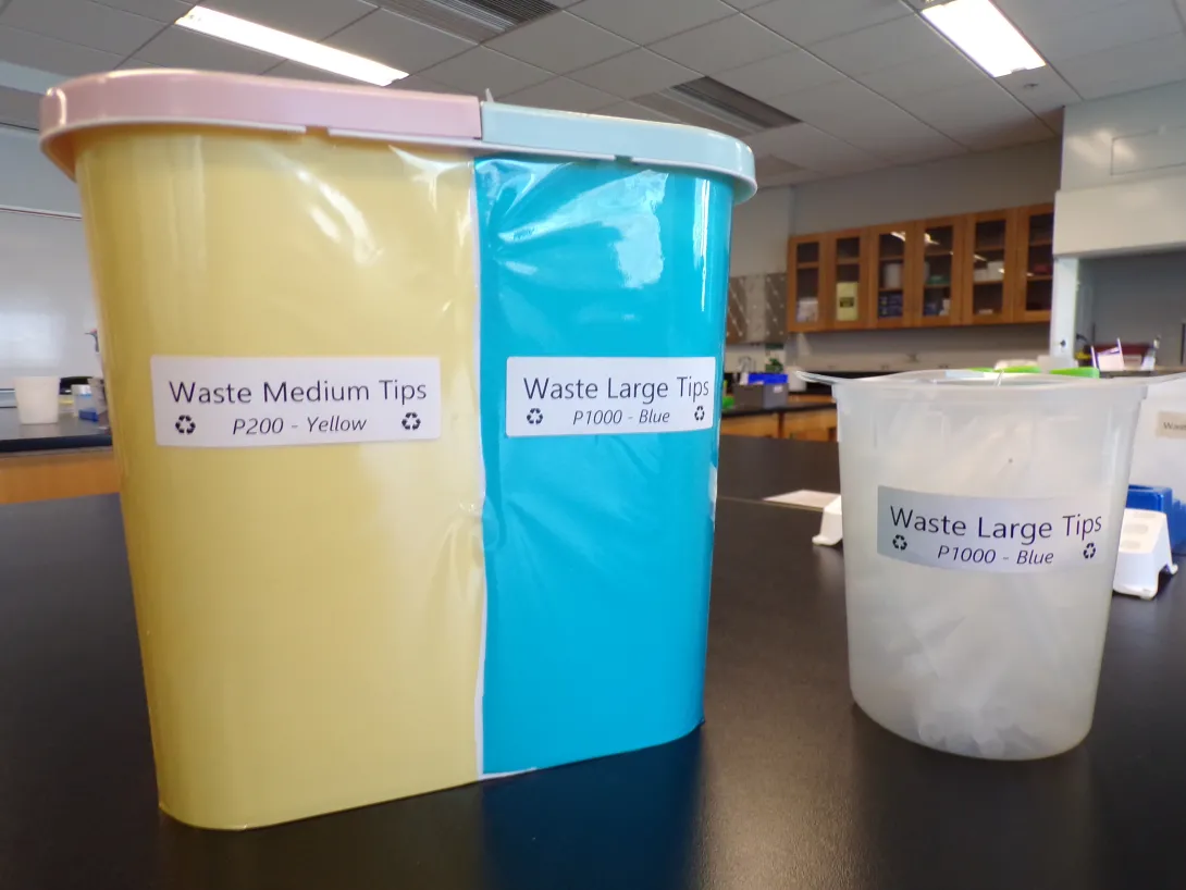 Photo of containers for recycling pipettes.