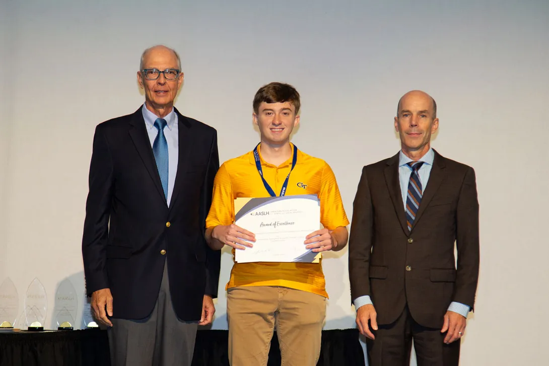Georgia Tech student Bruce Minix accepts Award of Excellence from the American Association of State & Local History in September 2023.