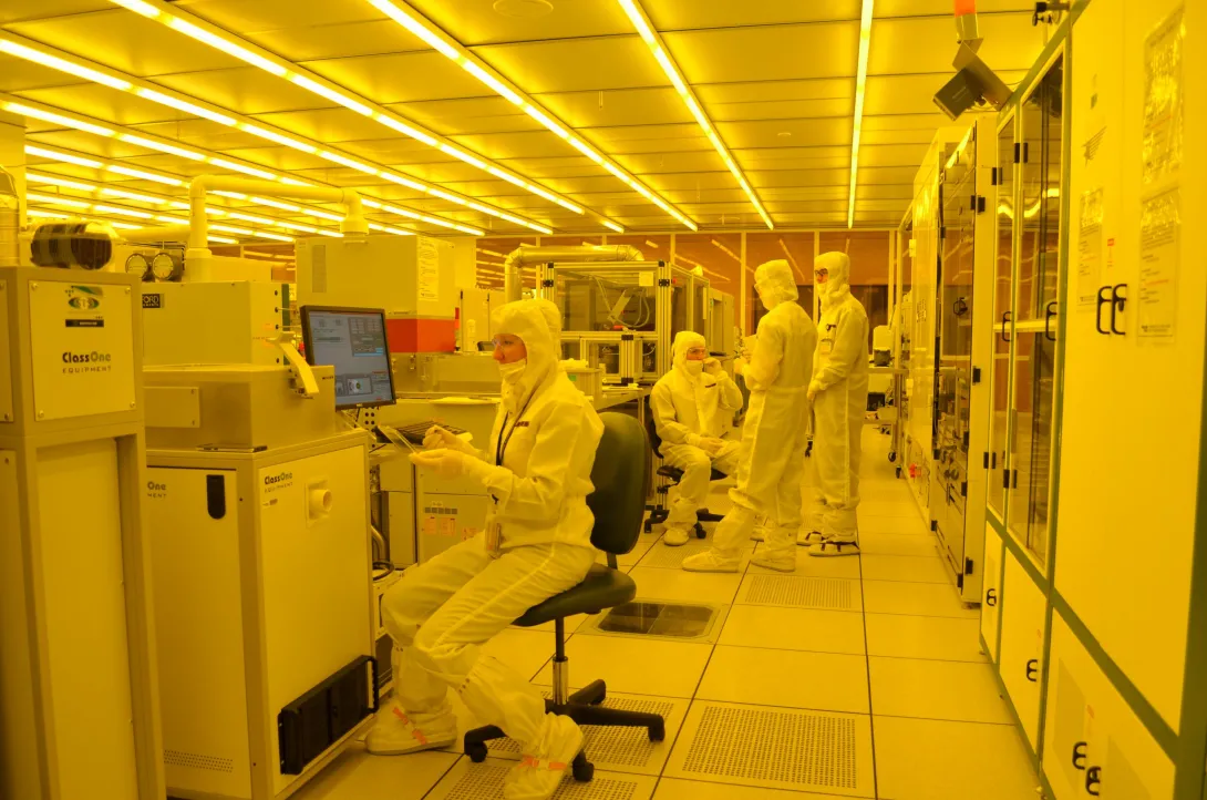 photograph of IEN technical staff in nanofabrication cleanroom