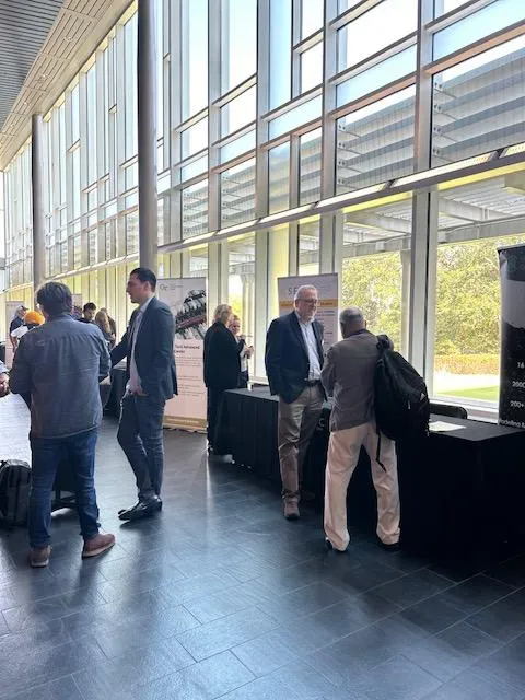 Visitors learning about research centers at the IMS Opening Showcase