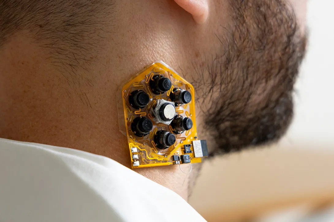 a patch of haptic actuators shown on a user's neck