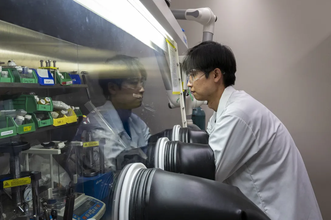 Sun Geun Yoon works in a glove box in McDowell’s laboratory at Georgia Tech.