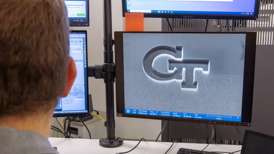 GT logo on an electron microscope