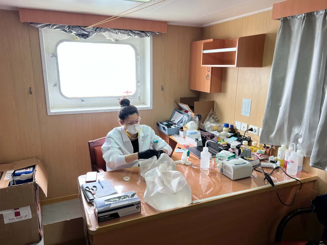 Patritsia in her cabin analyzing and labelling samples