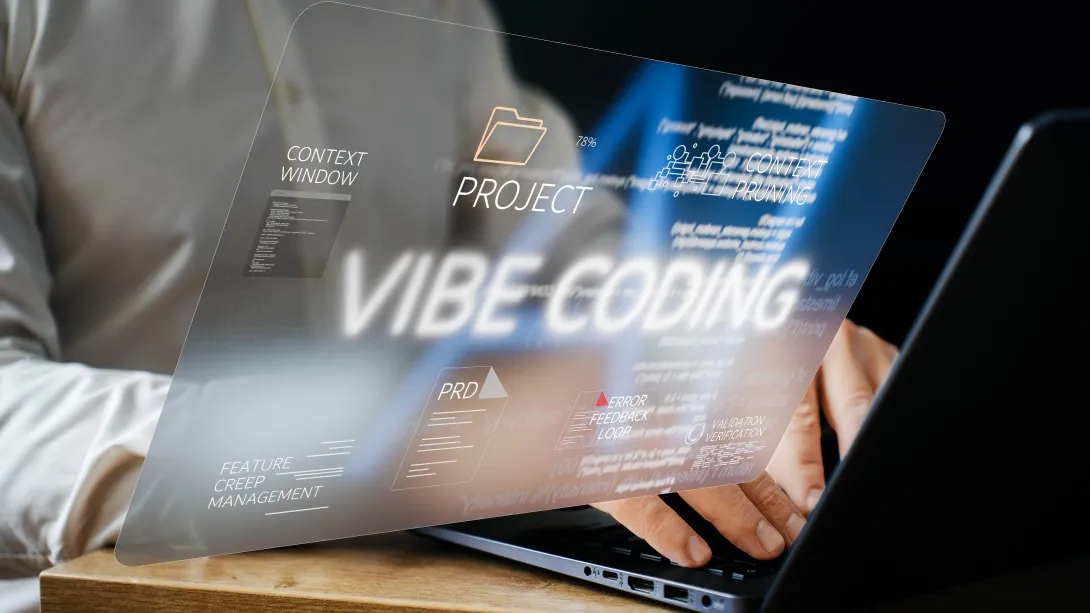 A man typing on a computer. There is a hovering screen hovering over his hands that says "Vibe Coding"