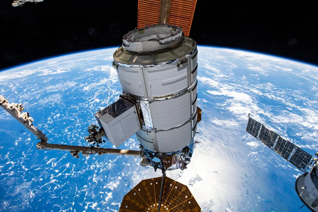 orthrop Grumman's Cygnus space freighter is pictured in the grip of the Canadarm2 robotic arm shortly after it was detached from the Unity module. The orbital complex was soaring 260 miles above the island archipelago of Seychelles in the Indian Ocean at the time of this photograph.
