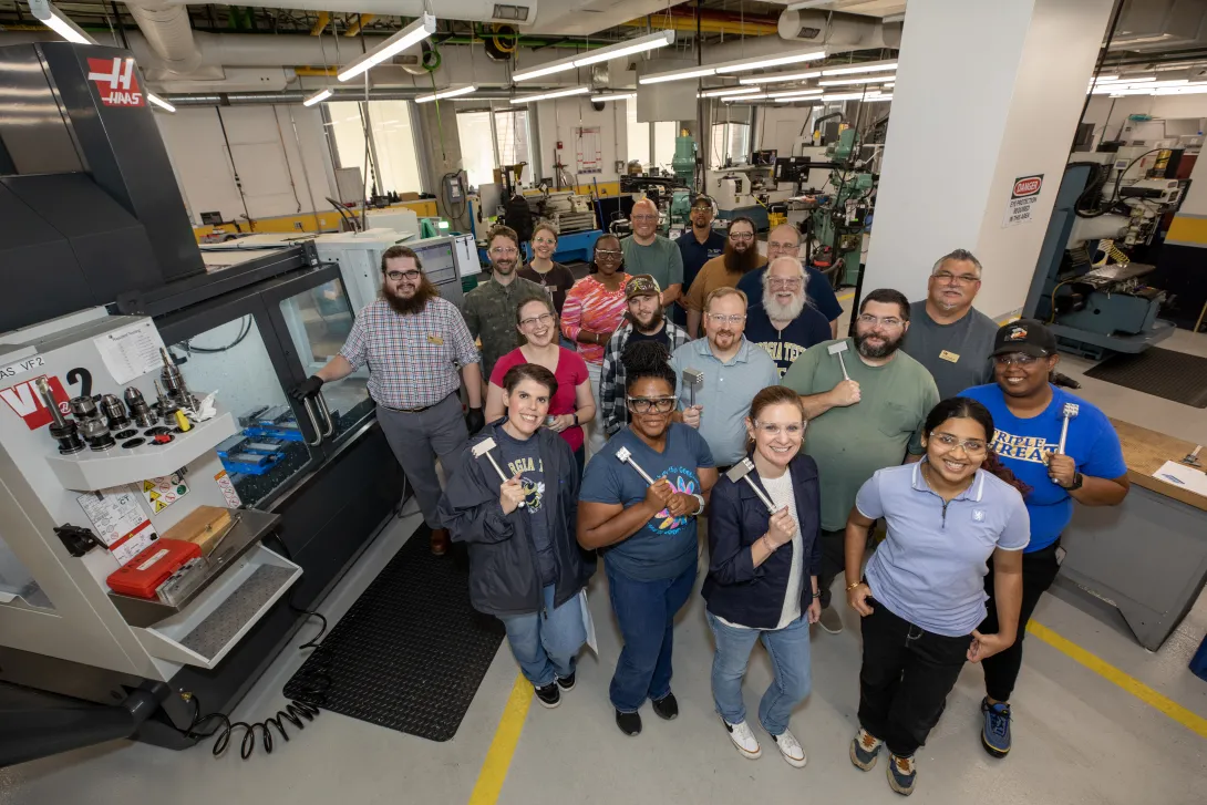 Participants in a Georgia Tech machining workshop pose for a group photo. 