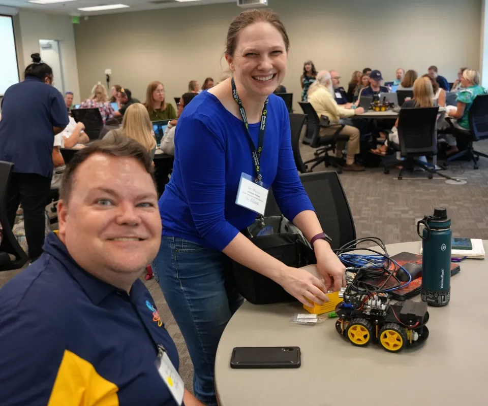 Rural CS teacher Jansen Haight with GTRI's Elizabeth Parrish at fall 2025 kickoff. 