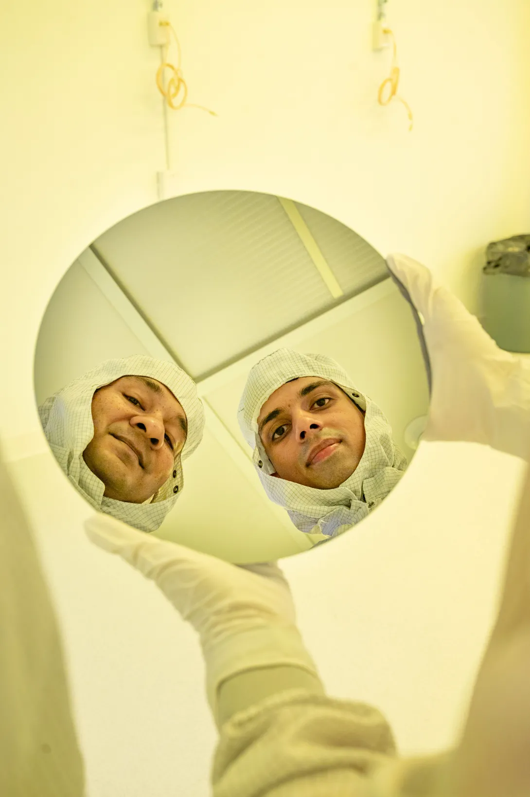 Researchers holding chip