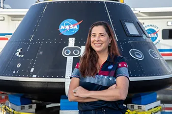 Liliana Villarreal in front of artemis capsule.