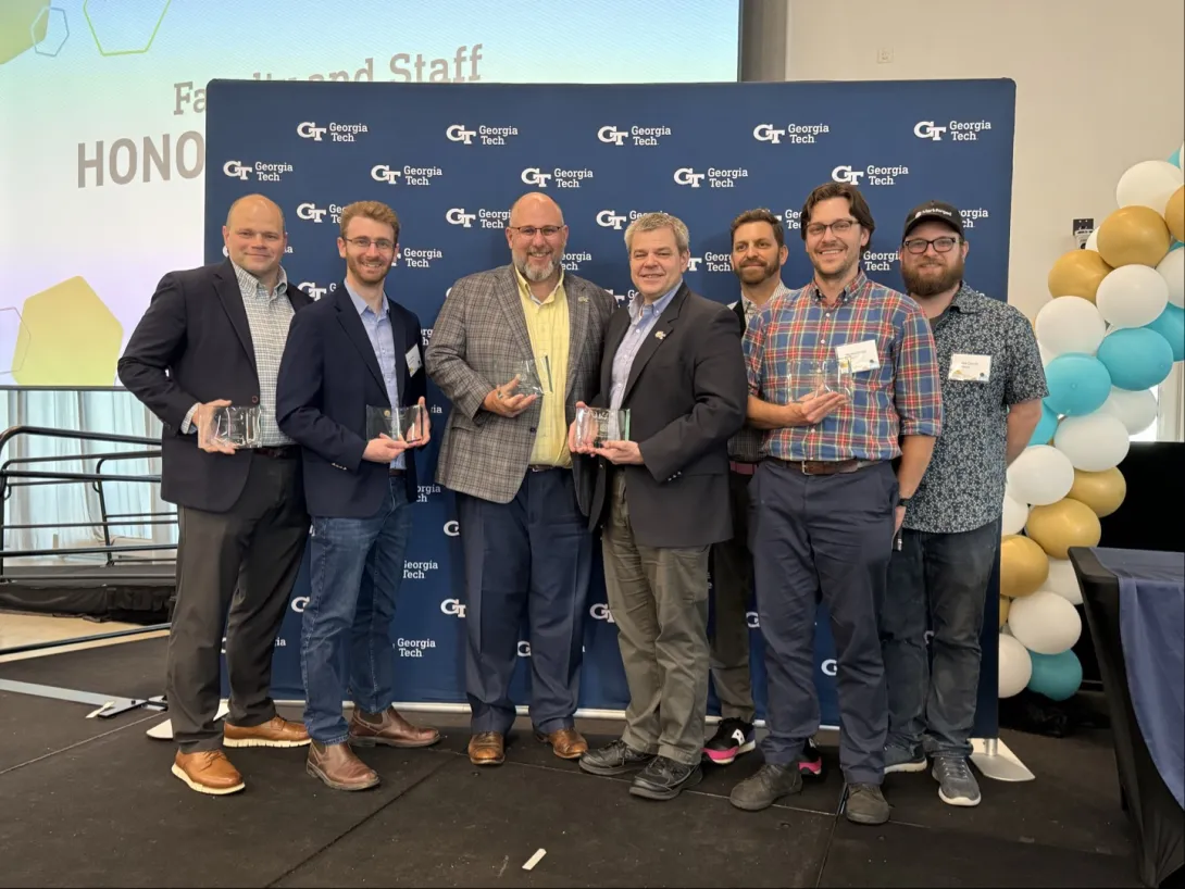 Steven Ferguson, Kyle Saleeby, Aaron Stebner, Thomas Kurfess, Stephan Turano, Weston Straka and Matt Carrol holding their interdisciplinary research awards