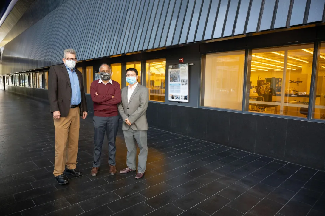 photograph of Oliver Brand, Madhavan Swaminathan, Shimeng Yu in Marcus corridor