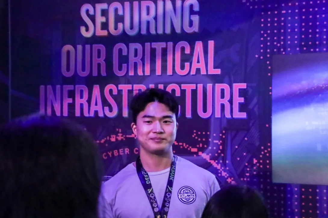 A man looking at the camera smiling. 